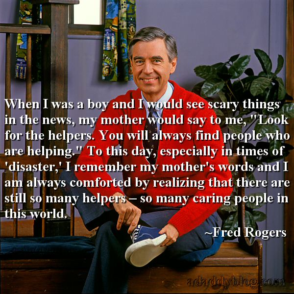 photo of Fred Rogers wearing a red cardigan sweater